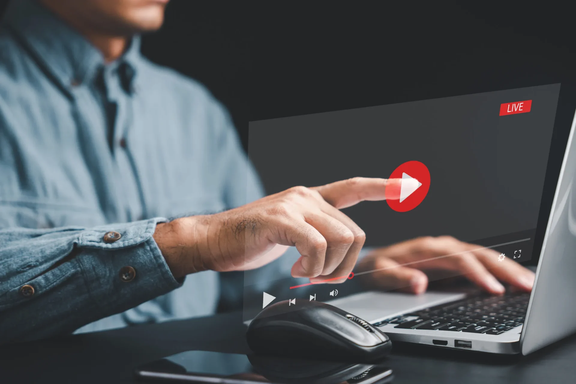 Enter the world of virtual streaming with a touch as a mans hand interacts with the screen, watching online videos, live concerts, and exploring the digital realm of technology